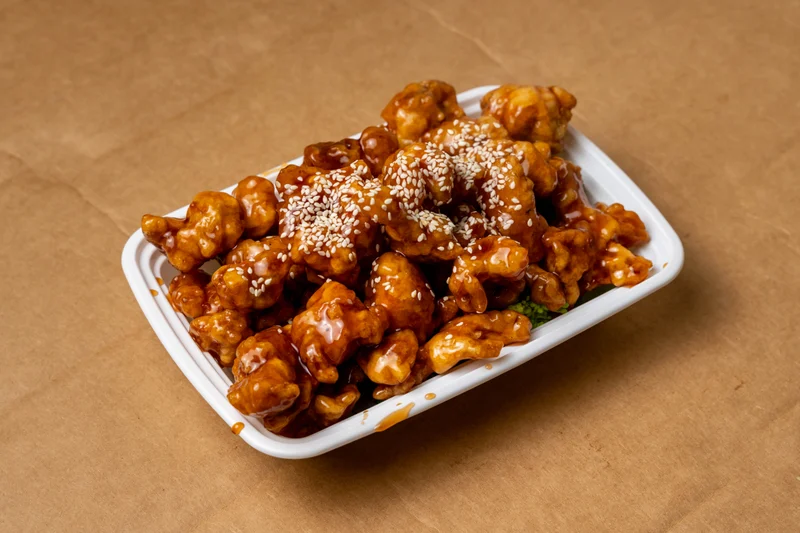Sesame Chicken — deep fried crispy chicken cooked in an exquisite sesame sauce